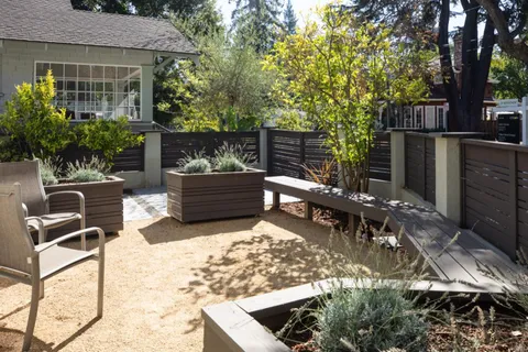 a view of a backyard with sitting area and furniture