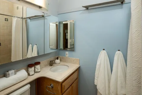 a bathroom with a sink and mirror