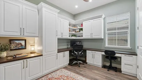 a kitchen with a sink cabinets and window