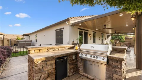 a view of a patio with a table and chairs