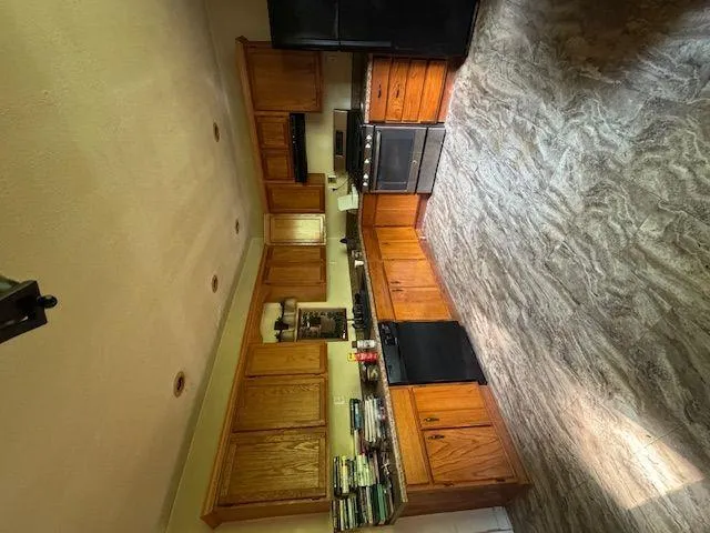 a view of storage and utility room with racks on the wall