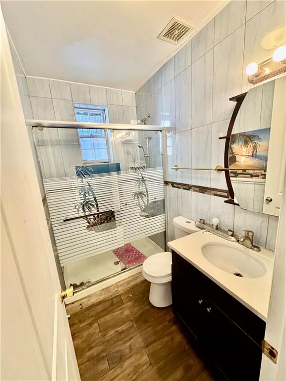 1476 67th Street, Unit 1 Brooklyn, NY 11219 - Photo 6 of 6 a bathroom with a sink and a mirror