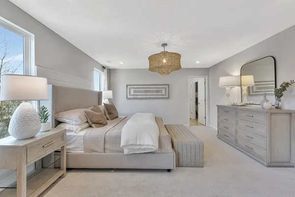a bedroom with bed and window