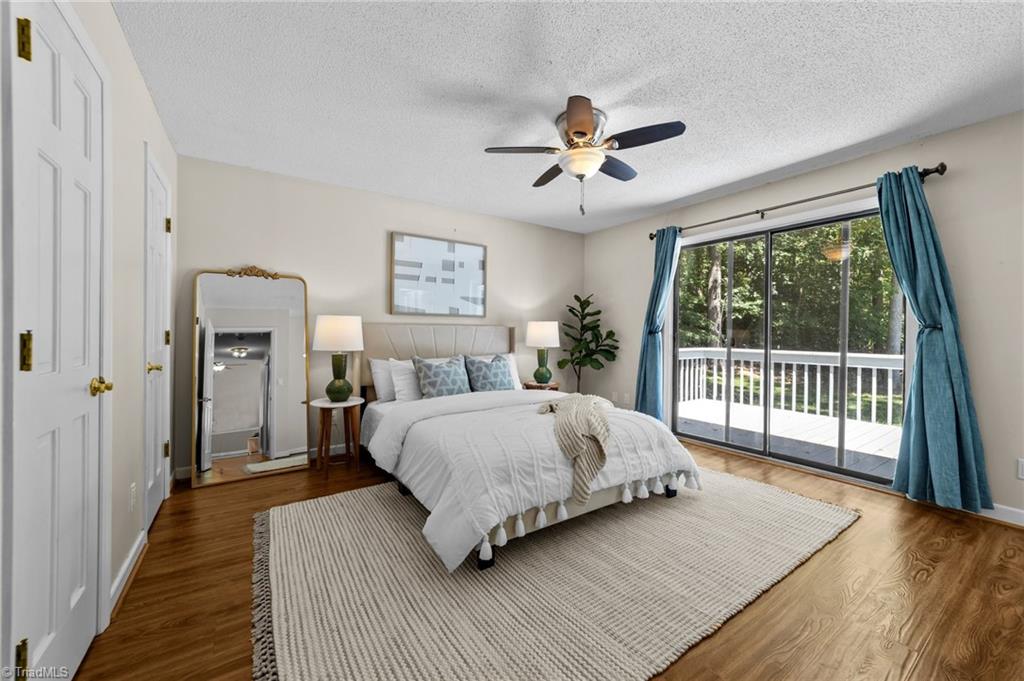 1827 Beckner Road Lexington, NC 27292 - Photo 3 of 50 Primary bedroom with view of manicured backyard, mature landscaping and pool.