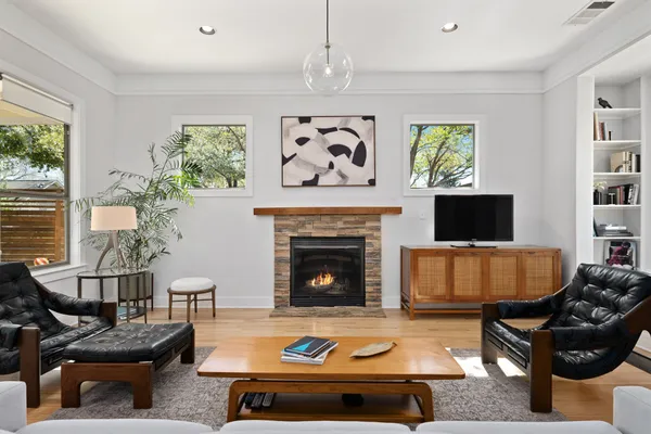 a living room with furniture and a fireplace