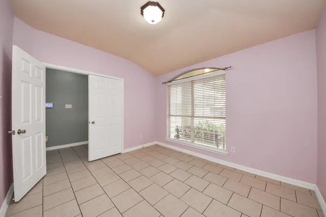 a view of an empty room and window