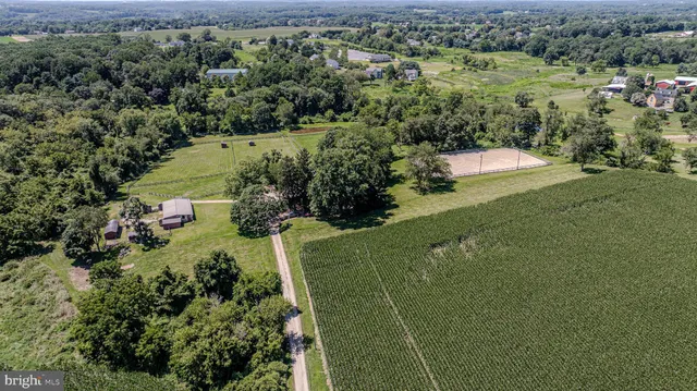 an aerial view of a houses with outdoor space and a lake view