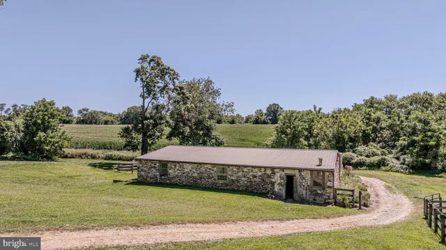 a view of a house with backyard porch and sitting area