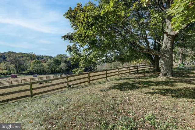 a bedroom with a large bed and a large mirror