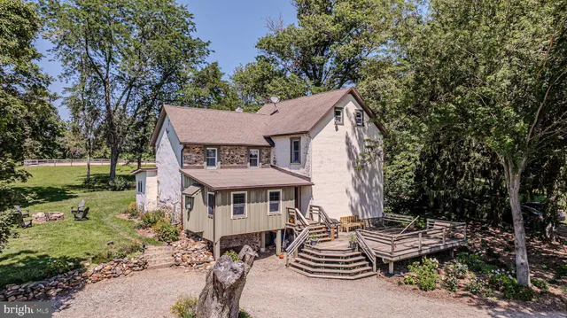 a bedroom with a bed and a table in it