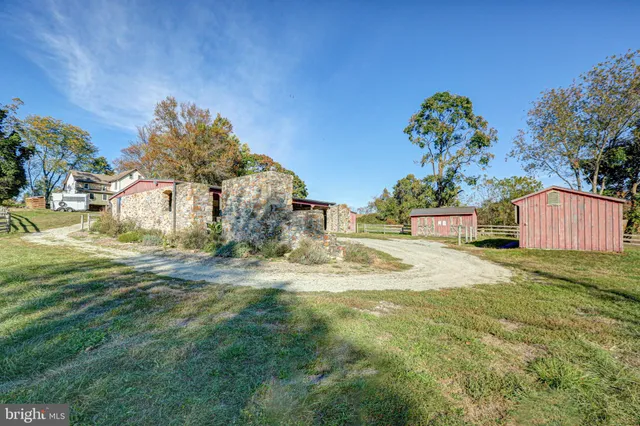 a bed sitting in a room next to a window