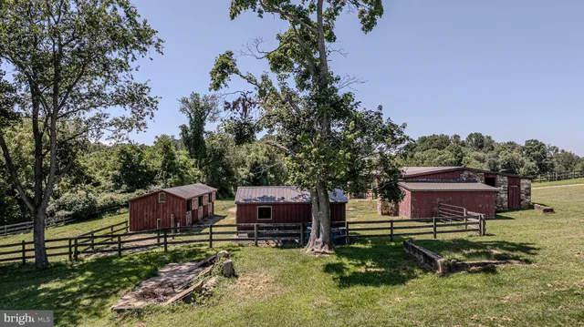 a view of a house with backyard porch and sitting area