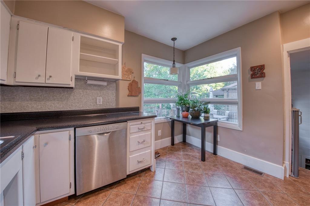 1129 Atlantic Avenue Monaca, PA 15061 - Photo 11 of 37 a kitchen with a sink and cabinets
