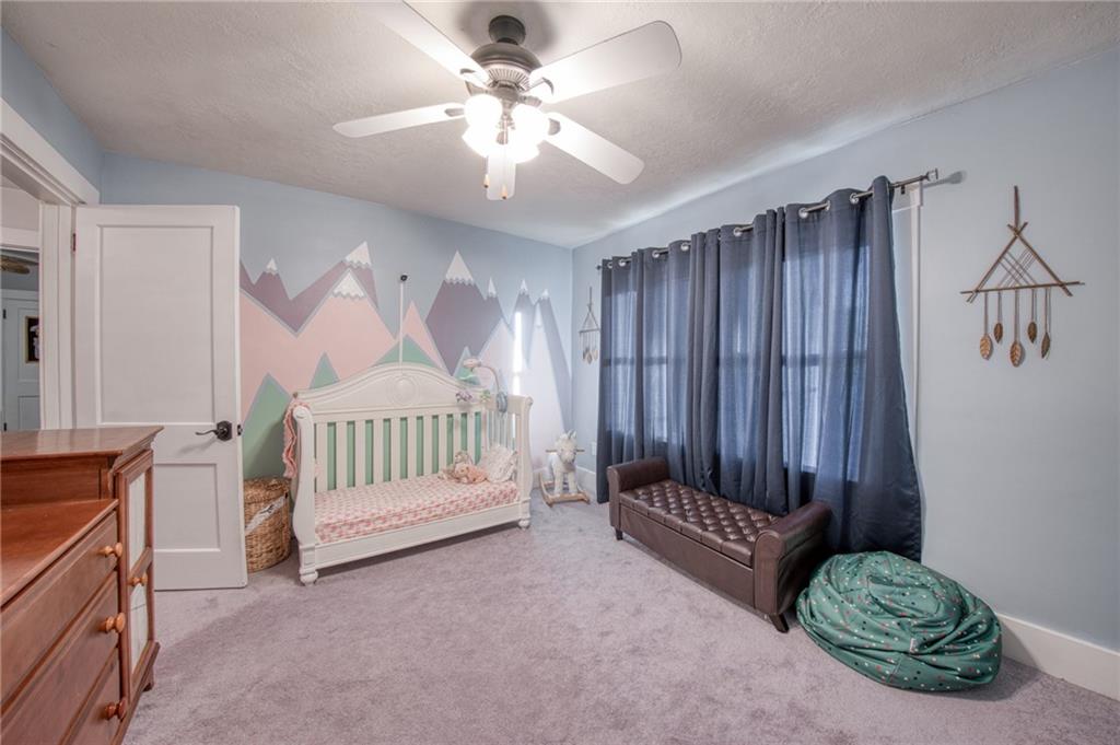 1129 Atlantic Avenue Monaca, PA 15061 - Photo 13 of 37 a view of a bedroom with furniture and windows