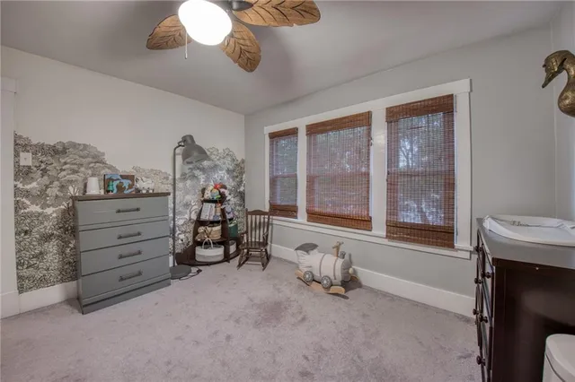 a bed room with a bed and a window