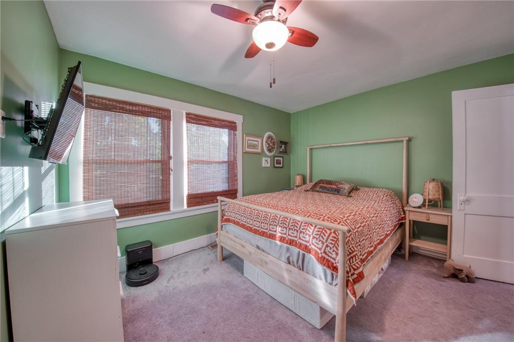 1129 Atlantic Avenue Monaca, PA 15061 - Photo 18 of 37 a bedroom with a bed and a chandelier