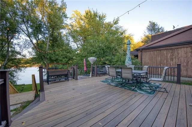 a view of a chairs and table on the wooden deck