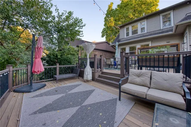 a view of a chairs and tables in the back yard of the house