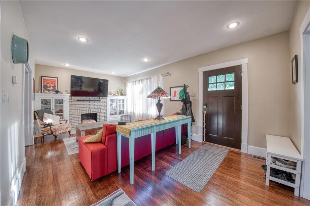1129 Atlantic Avenue Monaca, PA 15061 - Photo 3 of 37 a living room with furniture wooden floor and a fireplace