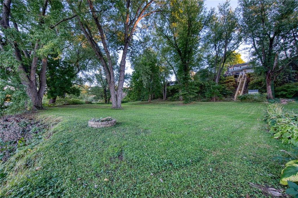 1129 Atlantic Avenue Monaca, PA 15061 - Photo 34 of 37 a view of a backyard with a garden and trees