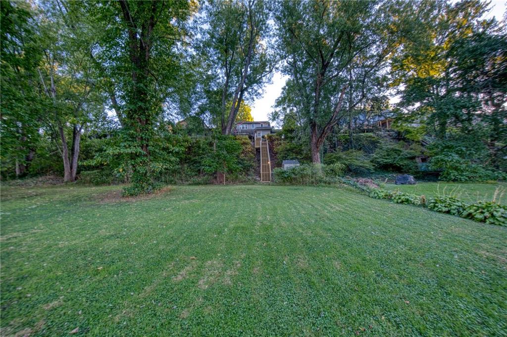 1129 Atlantic Avenue Monaca, PA 15061 - Photo 35 of 37 a view of a backyard with large trees