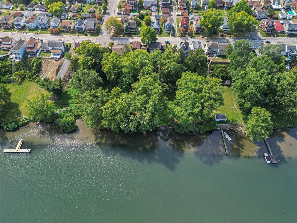 1129 Atlantic Avenue Monaca, PA 15061 - Photo 36 of 37 an aerial view of a house with a yard and lake view