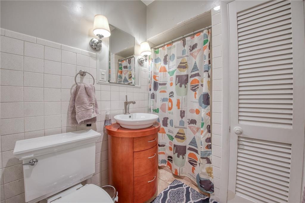 1129 Atlantic Avenue Monaca, PA 15061 - Photo 8 of 37 a bathroom with a sink and toilet