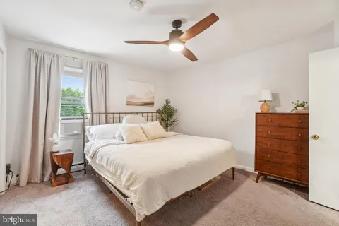 a bedroom with a bed and a cabinets