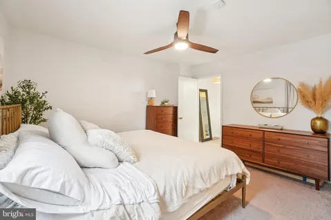 a bedroom with a bed and chandelier