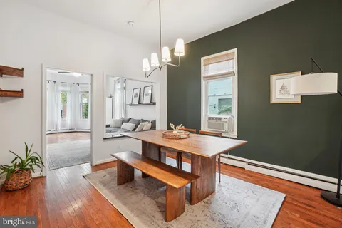 a room with wooden floor and window