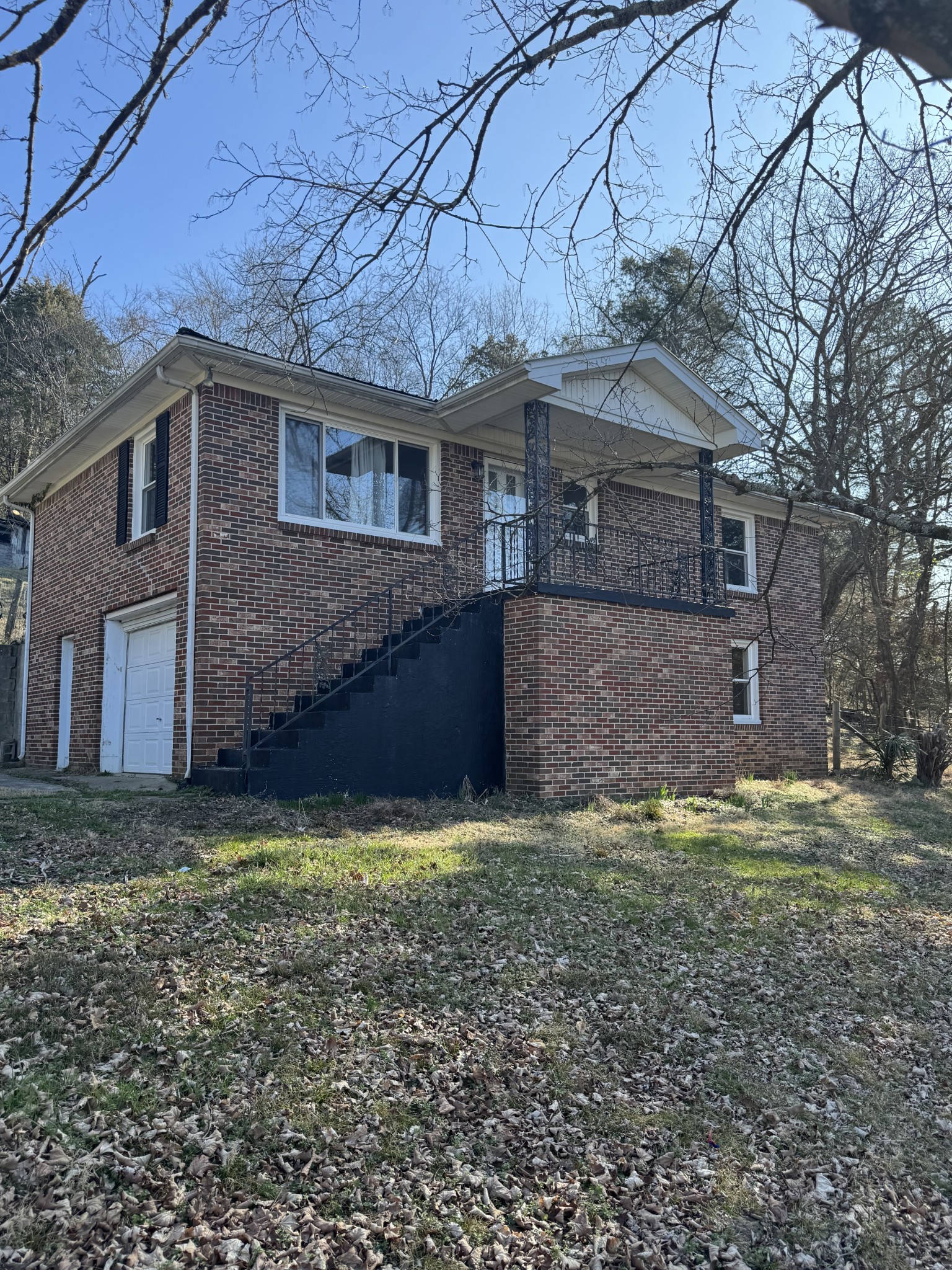 36 Hartsville Pike Carthage, TN 37030 - Photo 1 of 28 a view of a yard in front of a house with large trees