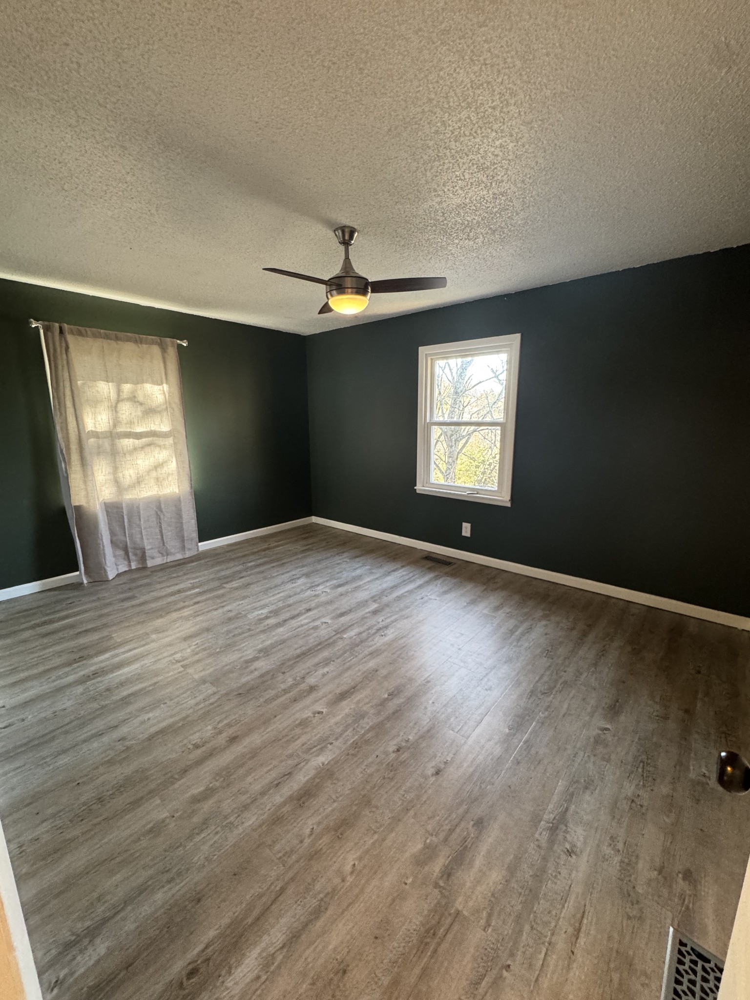 36 Hartsville Pike Carthage, TN 37030 - Photo 12 of 28 wooden floor in an empty room with a window