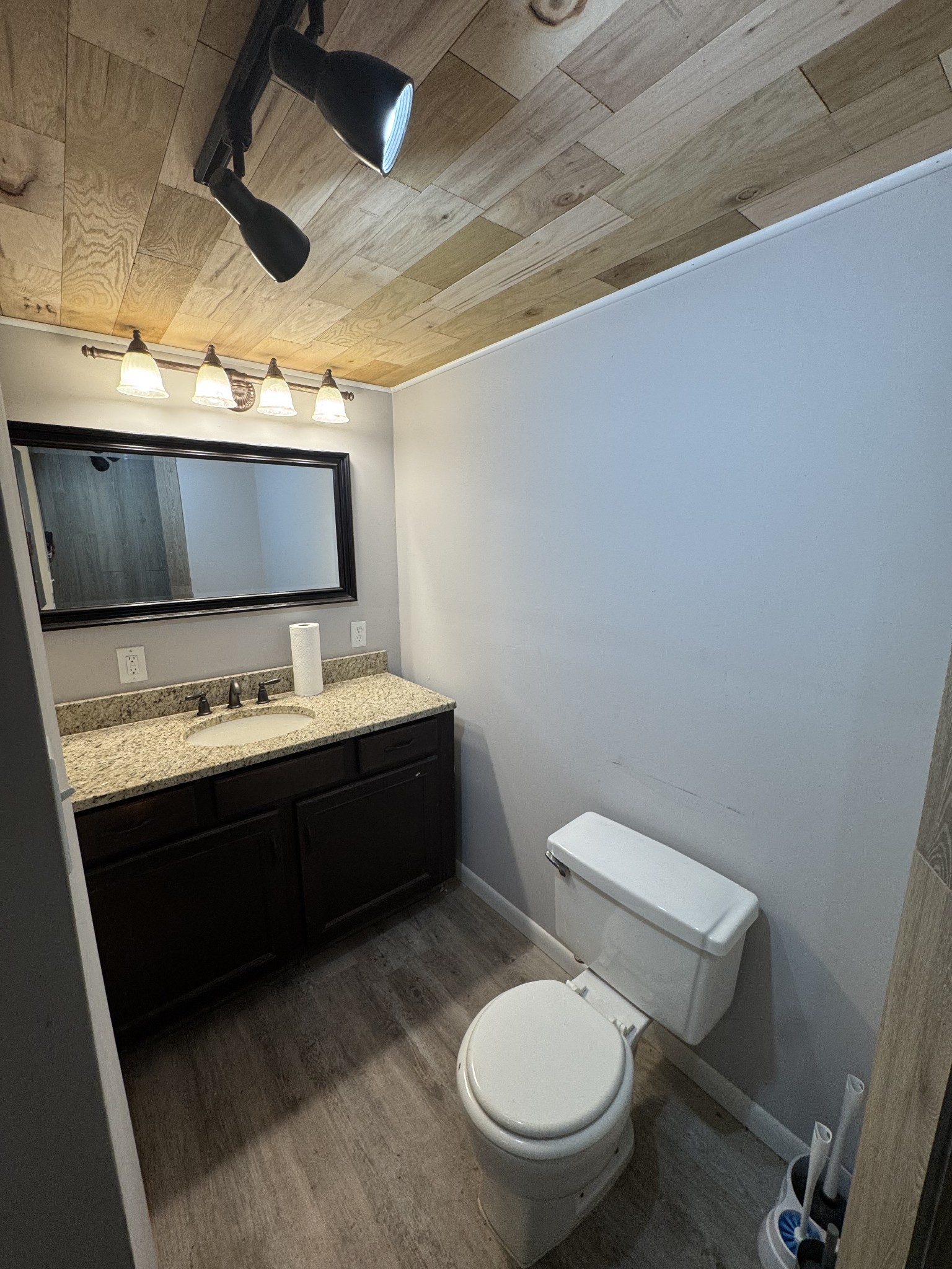 36 Hartsville Pike Carthage, TN 37030 - Photo 21 of 28 a bathroom with a granite countertop toilet sink and mirror