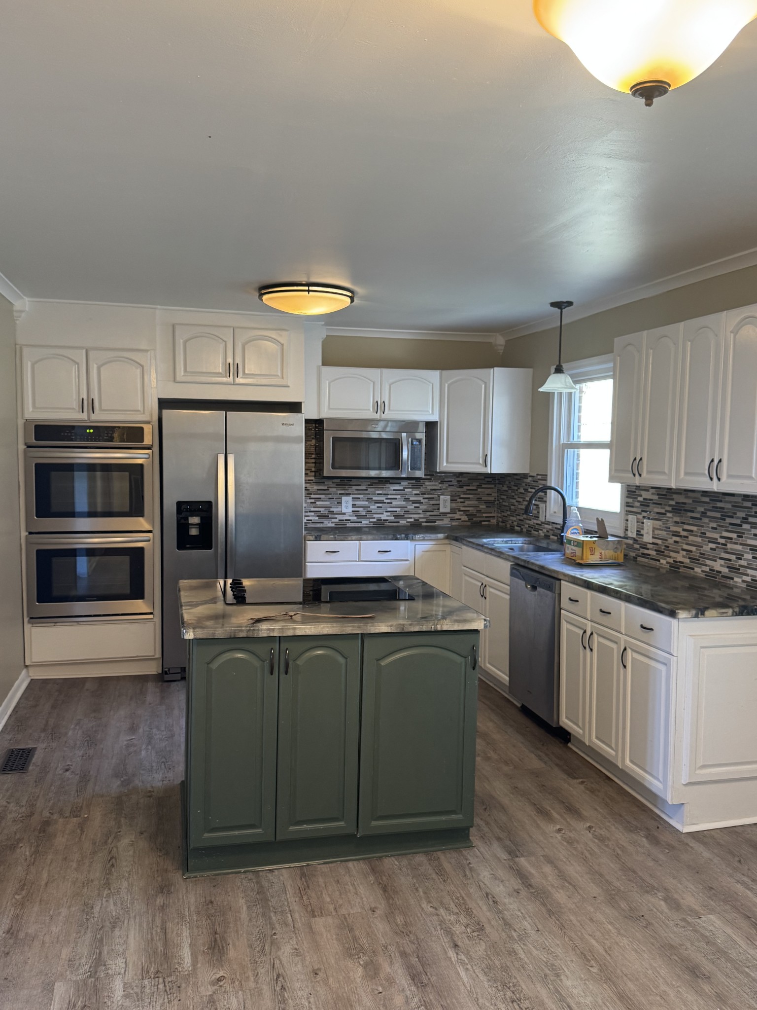36 Hartsville Pike Carthage, TN 37030 - Photo 8 of 28 a kitchen with stainless steel appliances granite countertop a stove a sink and a refrigerator
