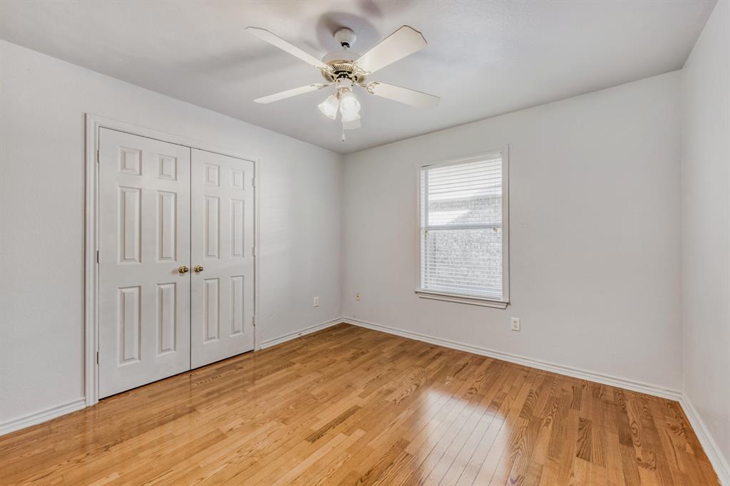 2617 Hereford Road Denton, TX 76210 - Photo 18 of 27 an empty room with windows and fan