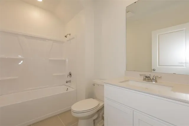 a bathroom with a double vanity sink and mirror
