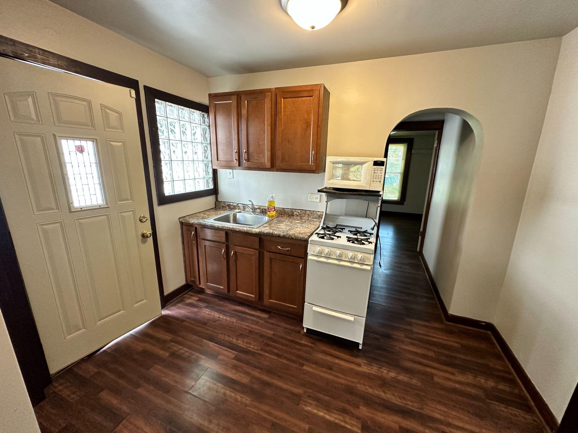 547 169th Street, Unit WEST Hammond, IN 46324 - Photo 2 of 7 a room with a sink and a mirror