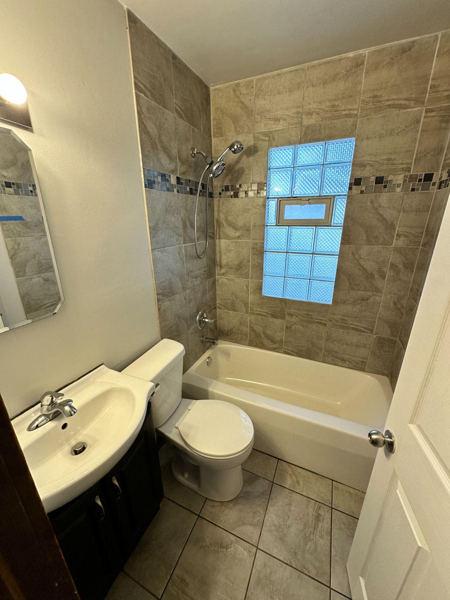 547 169th Street, Unit WEST Hammond, IN 46324 - Photo 7 of 7 a bathroom with a sink toilet and shower