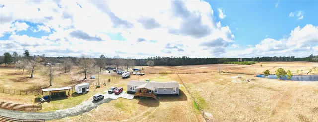 a view of swimming pool with outdoor seating