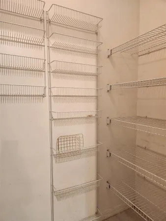 a view of a room with racks on the wall