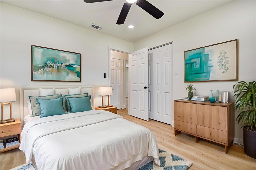 2015 Capri Road Valrico, FL 33594 - Photo 19 of 34 a bedroom with a large bed and a chandelier