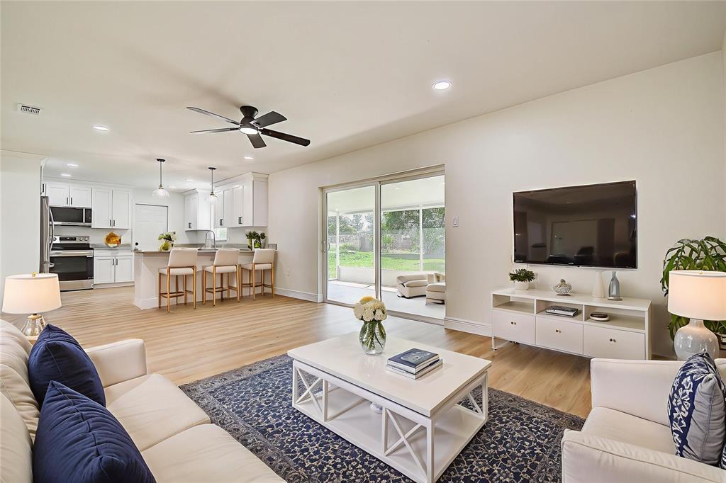 2015 Capri Road Valrico, FL 33594 - Photo 24 of 34 a living room with furniture and a flat screen tv