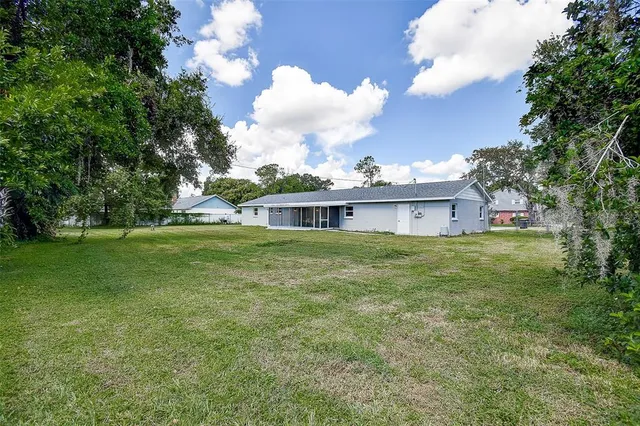 a view of a house with a big yard