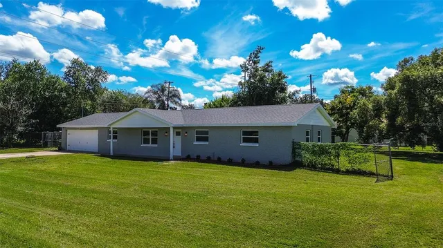 a view of a house with a big yard