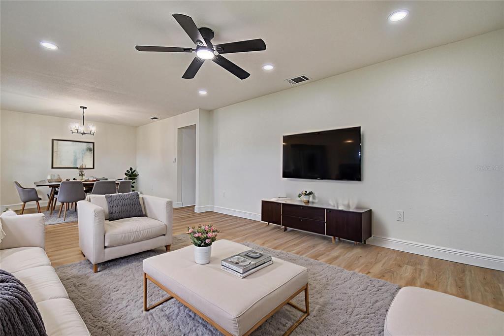 2015 Capri Road Valrico, FL 33594 - Photo 3 of 34 a living room with furniture and a flat screen tv