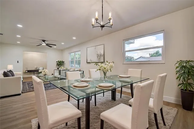 a view of a dining room with furniture window and wooden floor