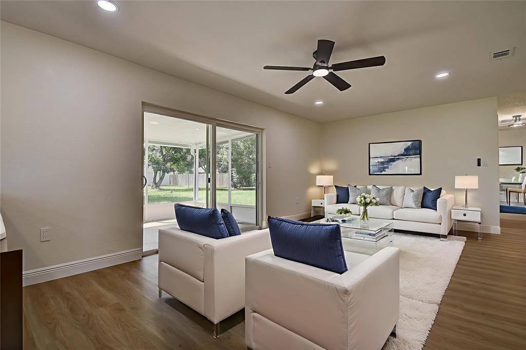 2015 Capri Road Valrico, FL 33594 - Photo 10 of 34 a living room with furniture and a large window