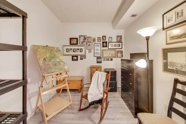a view of a livingroom with furniture and a window