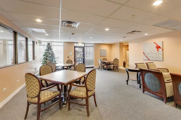 a very nice looking dining room with furniture