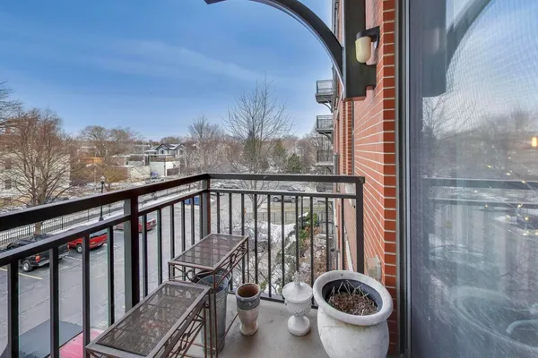 a view of a balcony with washer and dryer